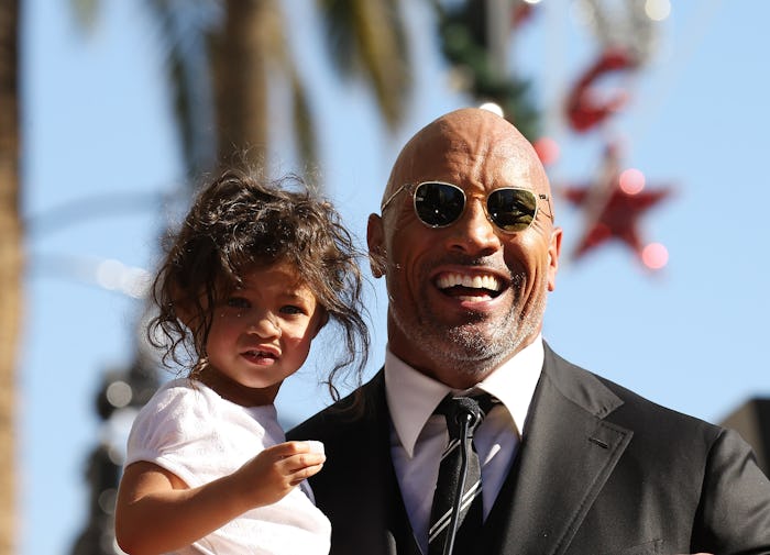 An adorable collection of photos of Dwayne "The Rock" Johnson with his kids