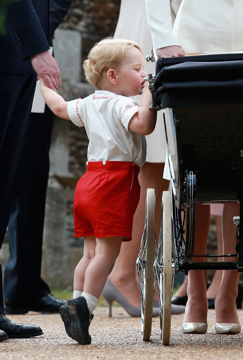 Prince George checks out his baby sister at her christening in 2015