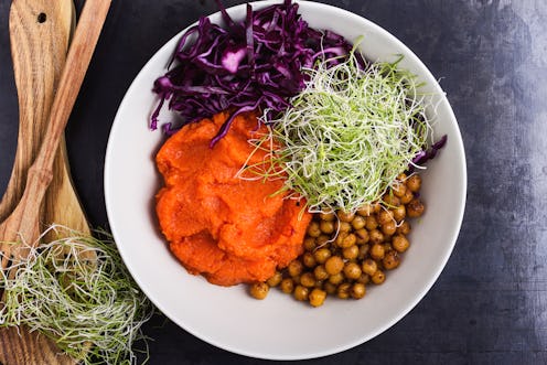 A colorful bowl of various vegan Thanksgiving foods. Your first vegan Thanksgiving can be tough, but...