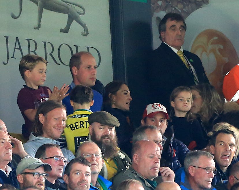 Prince George got excited at a football match while Princess Charlotte was more reserved.