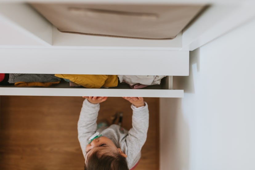 Experts say drawers are basically giant boxes to babies, and they love taking things out and putting...