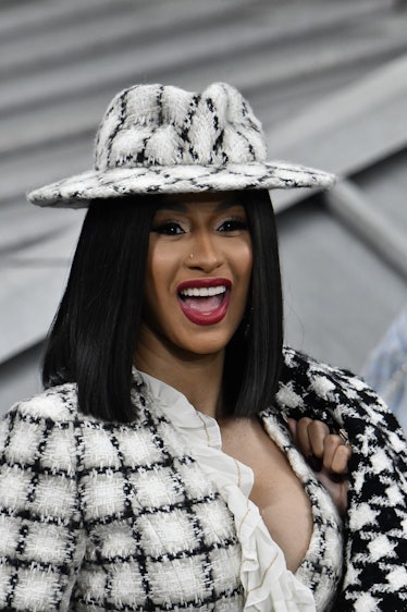 Cardi B slays in a black and white patterned ensemble.