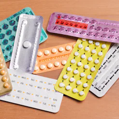 A pile of birth control pill packages in different colors