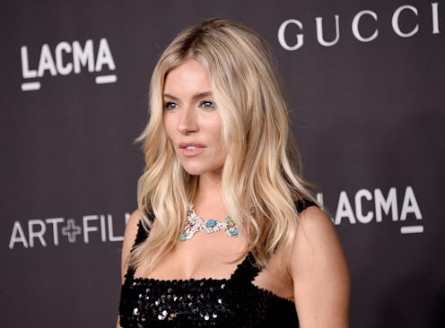 Sienna Miller at LACMA with her hair down, in a black sequin dress and a Gucci necklace