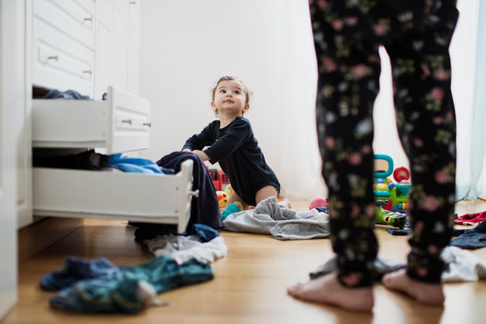 Exploring the world around them explains why babies love playing in drawers.