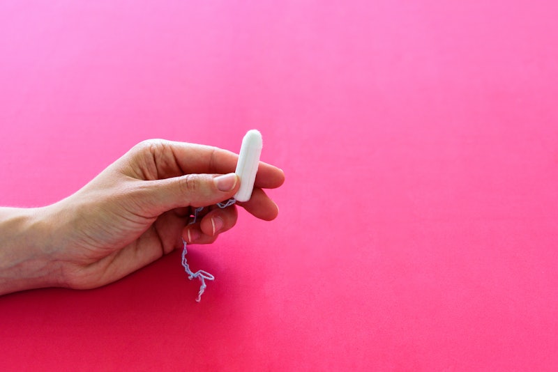 A person holds a tampon on a pink background. If you want to skip your period, birth control is your...