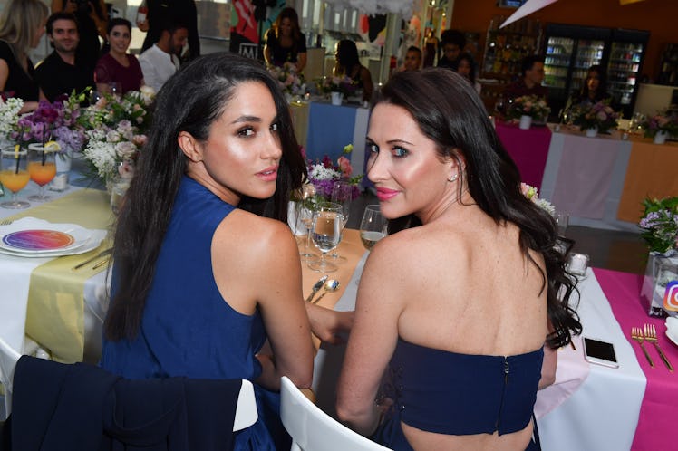 Meghan Markle and Jessica Mulroney pose for a photo.