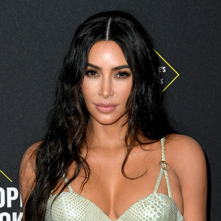 Kim Kardashian hits the red carpet in a snakeskin dress.