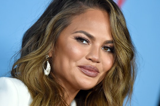 Chrissy Teigen was reminded she "just" had a baby during a yoga recent class