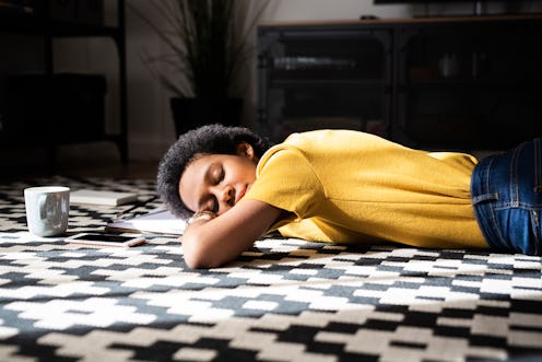 A woman lies on the floor. Signs you have low estrogen can range from the expected to the surprising...
