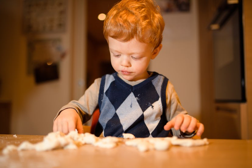 Playing with dough can help keep your toddler busy while cooking. 