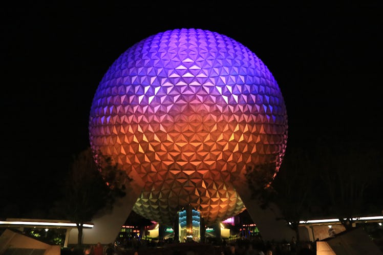 Disney's Epcot park is illuminated with different colors at night, and around the holidays. 