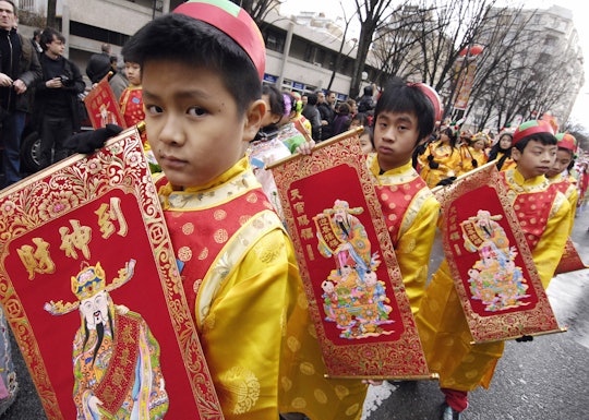 kids lined up in a Chinese new year parade