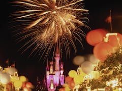 Fireworks and Mickey Mouse-shaped balloons light up the night sky on New Year's Eve at Disney World.