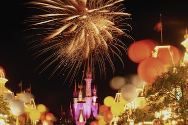 Fireworks and Mickey Mouse-shaped balloons light up the night sky on New Year's Eve at Disney World.