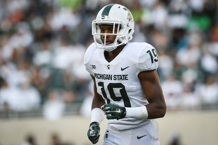 Josh Butler brought his two dogs to senior night at Michigan State University.