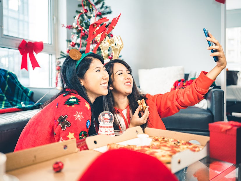 Two women take a selfie at a holiday party. If you're feeling uncomfortable with a discussion of bod...