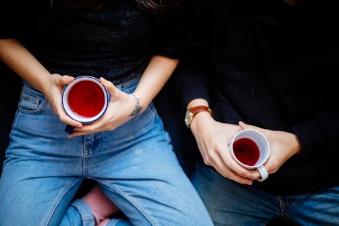 Two women hold herbal tea. Going sober for January is increasingly popular, and you may see small ch...