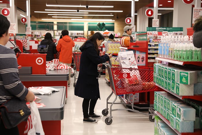 a woman standing in line at target