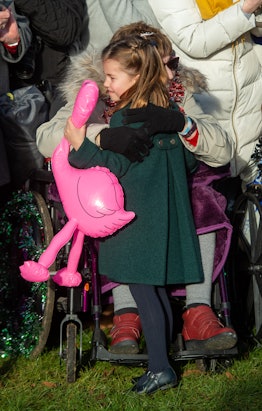 Princess Charlotte held a pink ostrich balloon during her walk.