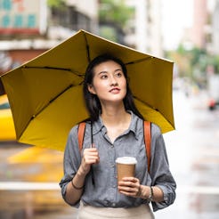 A woman walks with tea. Going without alcohol for the month of January can have many effects on your...