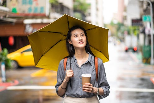 A woman walks with tea. Going without alcohol for the month of January can have many effects on your...