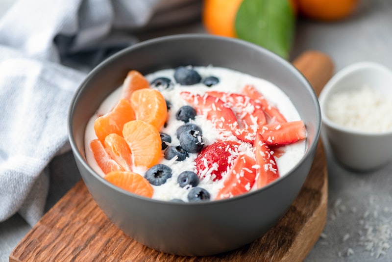 Vitamin C meal with yoghurt, tangerines, blueberries and strawberries for boosting the immune system