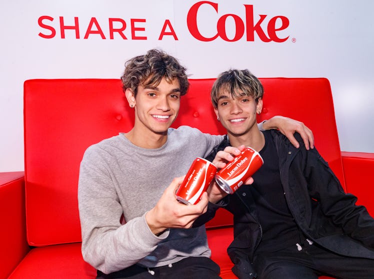The Dobre Twins attend an event for Coca Cola.