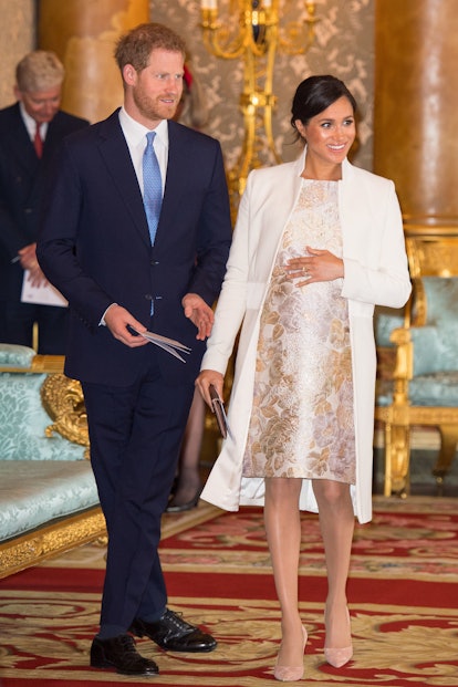 Meghan Markle's wore a brocade dress and Amanda Wakeley coat to celebrate Prince Charles. 