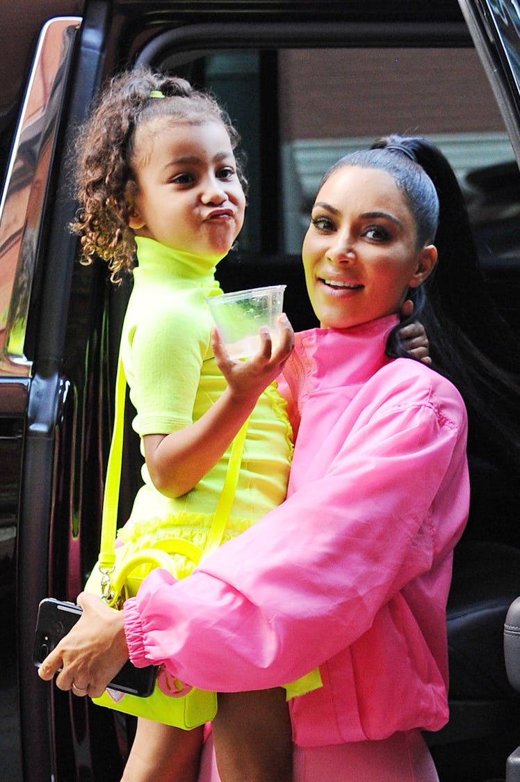 North West and Kim Kardashian step out in neon outfits.