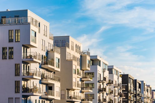 A row of modern buildings. LGBTQ housing discrimination is more common than it should be, so lawmake...
