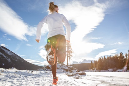 A woman runs in a snowy landscape. As days become longer and hotter after the winter solstice, our c...