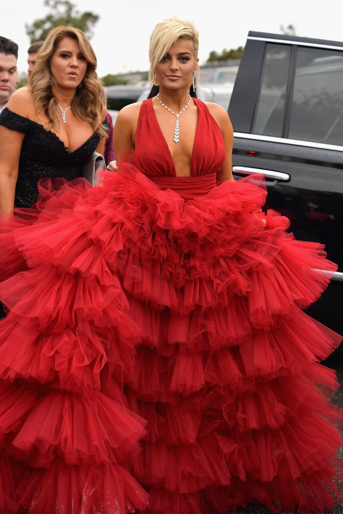Bebe Rexha S Grammys 19 Dress Is A Fiery Red Dream With A Million Ruffles