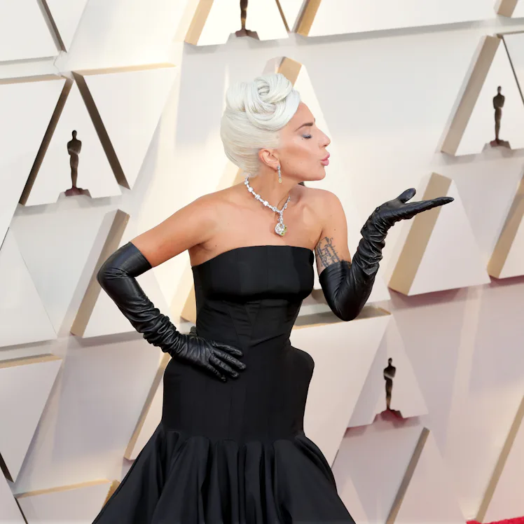 lady gaga strapless dress You can never go wrong with black a dress. , #LadyGaga wearing a strapless black floor length dress with a V-neckline at the premiere of #TheDevilWearsPrada2 , Video: @annabeliwegbue