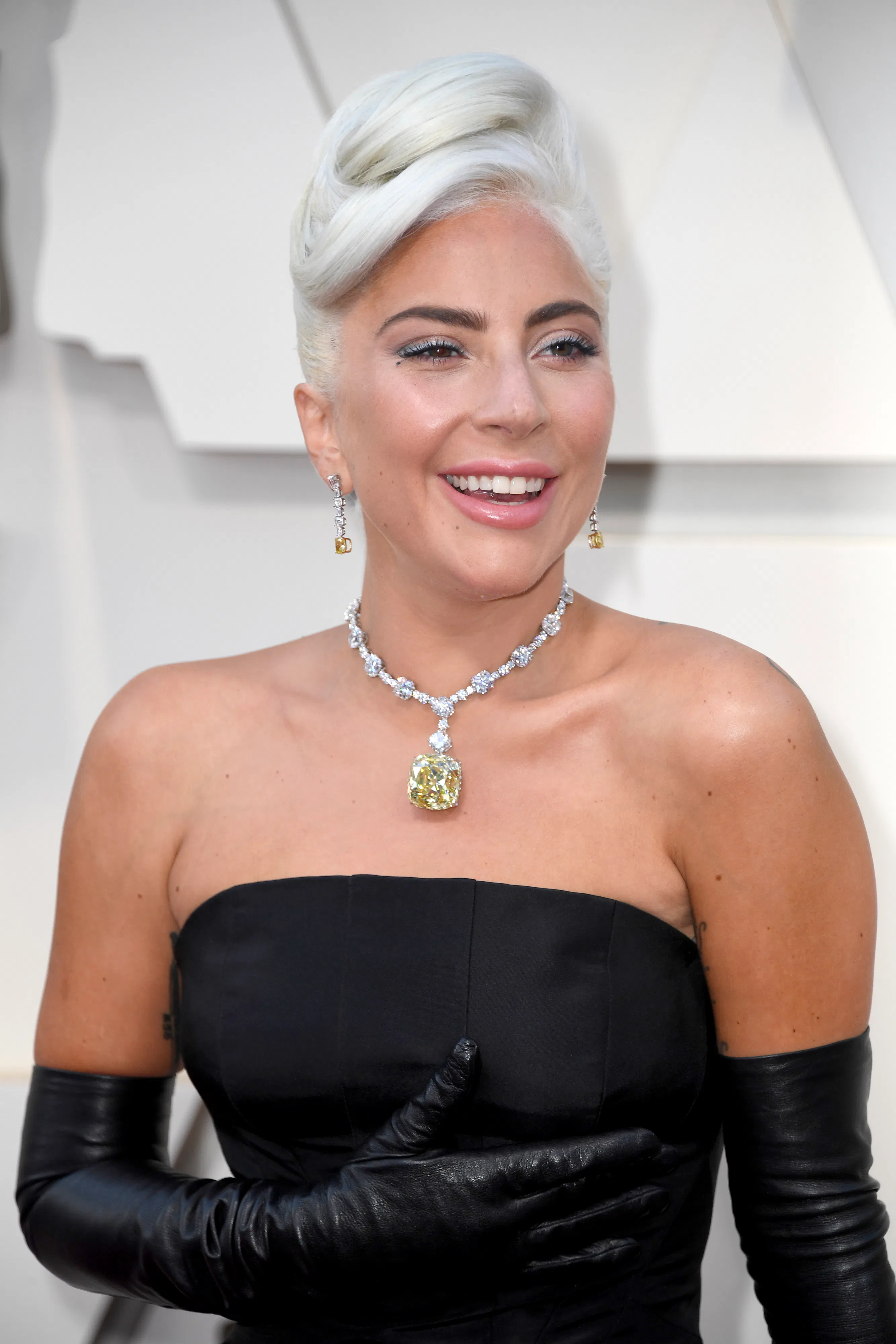 Lady Gaga's 2019 Oscars Dress Is A Classic Silhouette, But Her Jewels Are  Where It's At