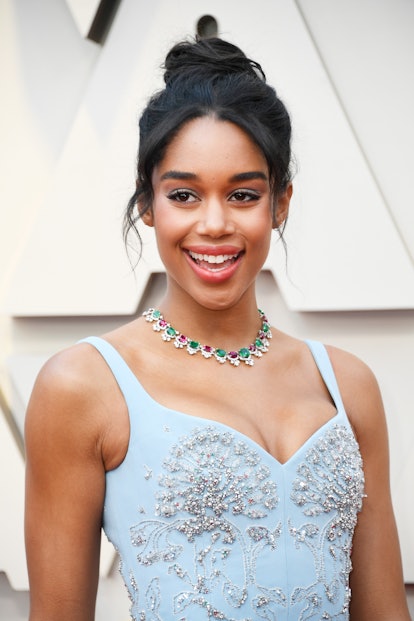 Laura Harrier with an up do, a light blue gown with rhinestones and matching blue eyeshadow 