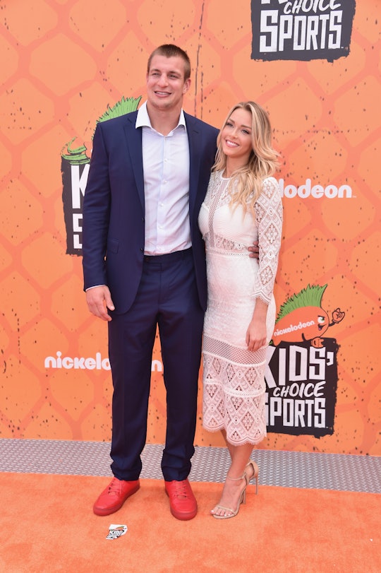 Rob Gronkowski and his partner posing at a red carpet