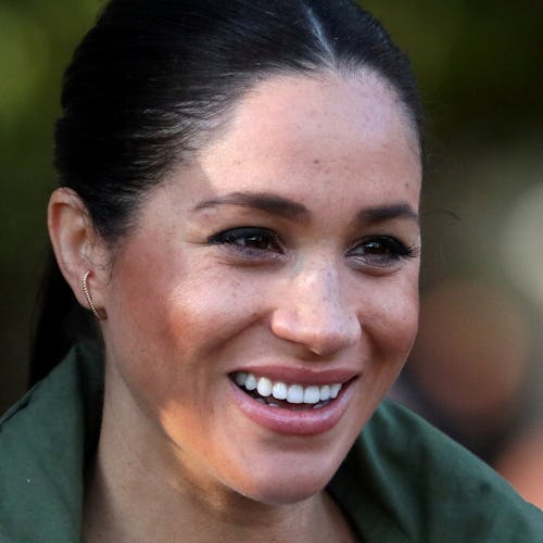 Full-profiled Meghan Markle smiling