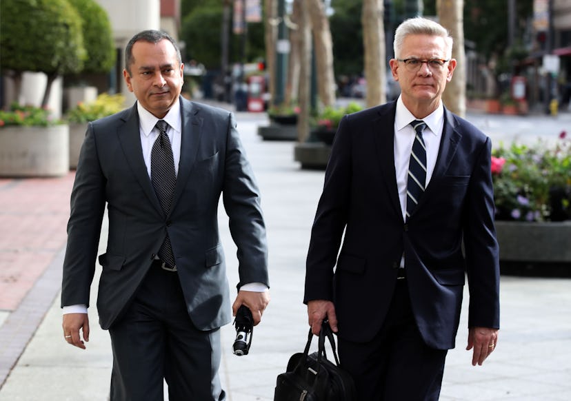 Former Theranos COO Ramesh Balwani (L) leaves the Robert F. Peckham U.S. Federal Court with his atto...
