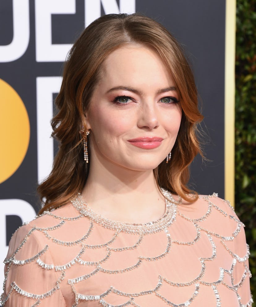 Emma Stone with a peachy pink eye matching her embellished Golden Globes dress.