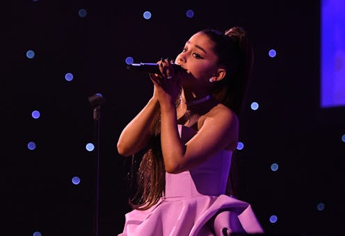 Ariana Grande in a pink dress during her performance