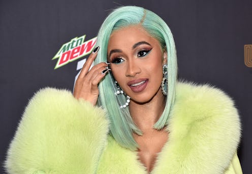 Cardi B in a yellow jacket at the 2019 Billboard Music Award Nominations