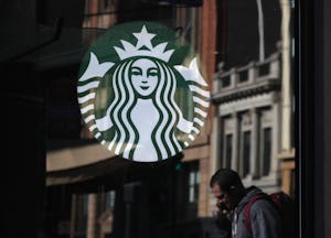 Starbucks logo on Starbucks store window. 