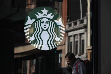 Starbucks logo on Starbucks store window. 