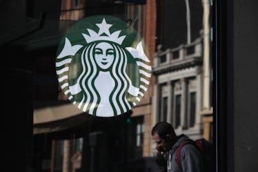 Starbucks logo on Starbucks store window. 