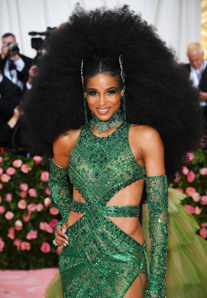 Ciara with her textured afro hairstyle in a green gown