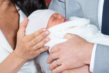 Prince Harry holding baby Sussex