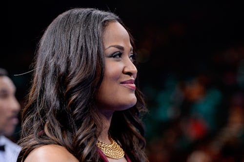 Laila Ali standing and smiling