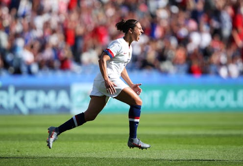 Female soccer player celebrating a goal