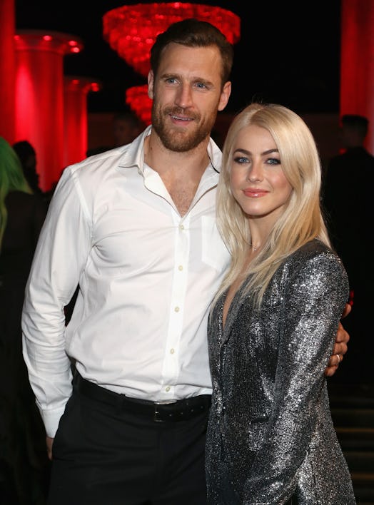 Julianne Hough in a sparkly silver dress and Brooks Laich in a white button-up